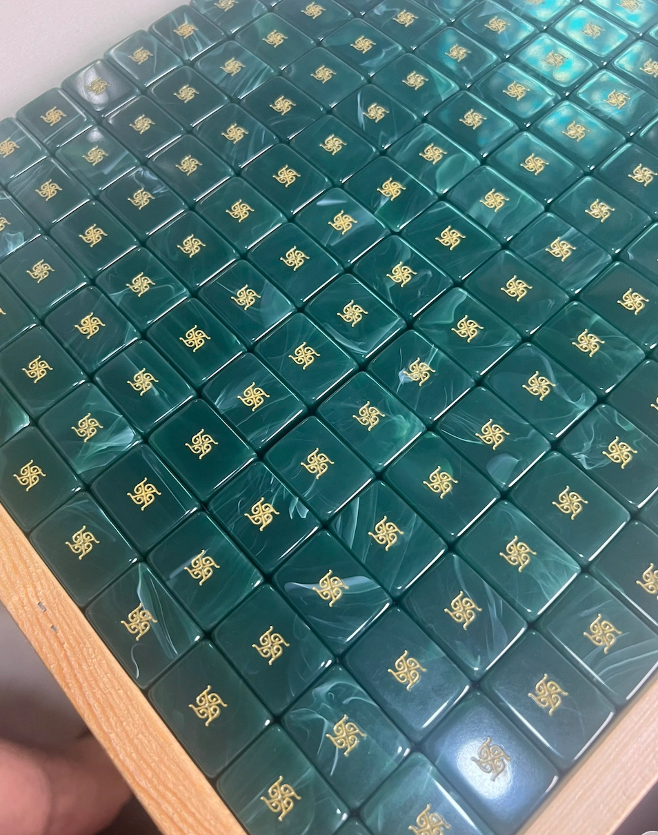 Emerald Tradewind mahjong tile backs with gold Tala marks