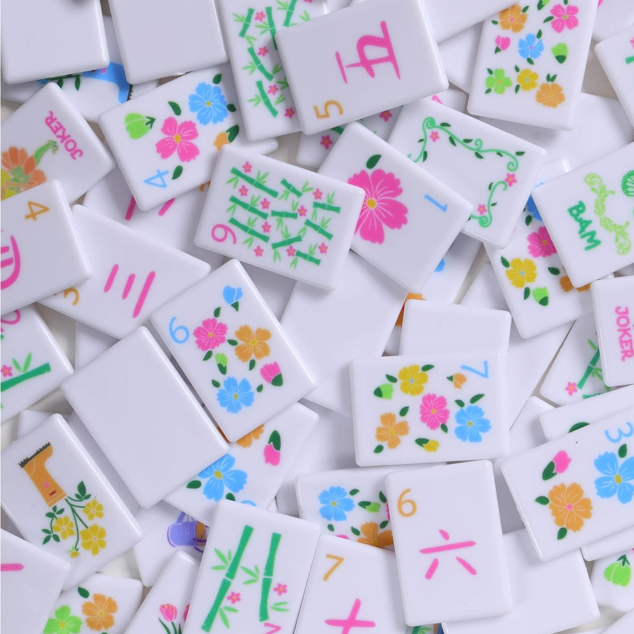 Fairy Garden mahjong tiles scattered — flower dots, bamboo bams, butterfly dragons and jokers