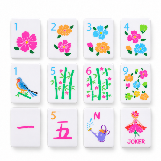 Fairy Garden mahjong tiles close-up — flower dots, bamboo bams, pink cracks, watering-can wind and fairy joker