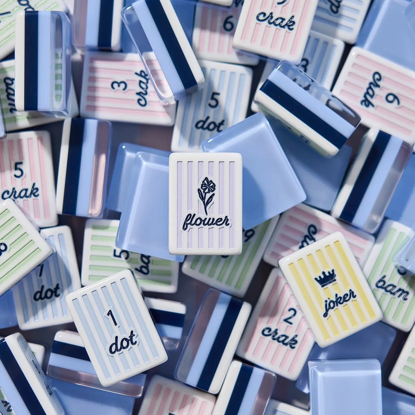 Cabana Stripe mahjong tile set — striped acrylic tiles in Carolina Blue and pastels