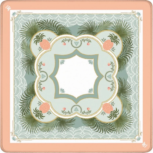 Pineapple Palms mahjong mat with coral pineapples, palm fronds, and an ornate medallion on a peach border