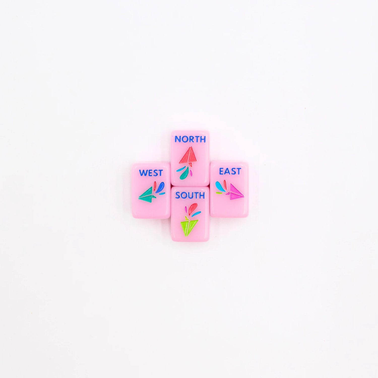 Pink Go Anywhere mini mahjong wind tiles: North, South, East and West with paper-airplane designs