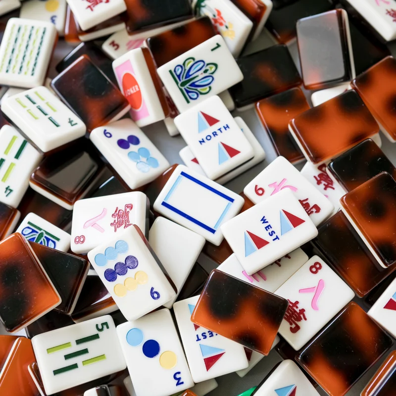 Close-up pile of Tortoise and Cream Mod mahjong tiles