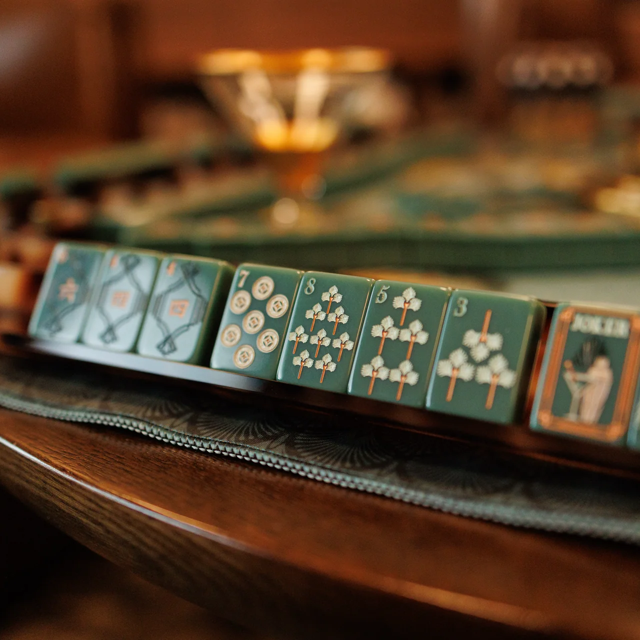 Green Light Gatsby mahjong tile set — deep green acrylic tiles with Art Deco details