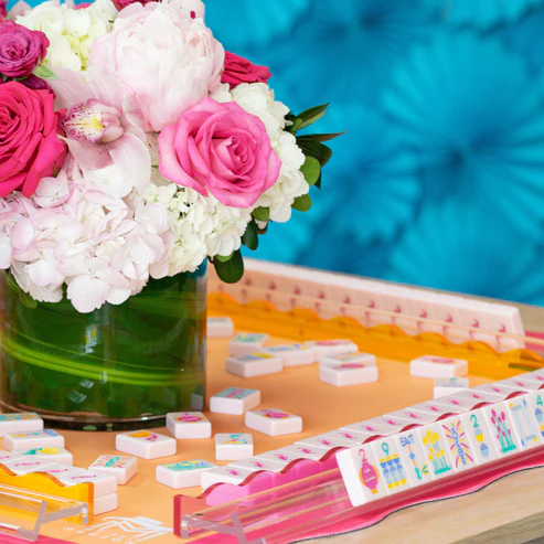 Lumera Series pink Mahjong tiles styled on a colorful American Mahjong table