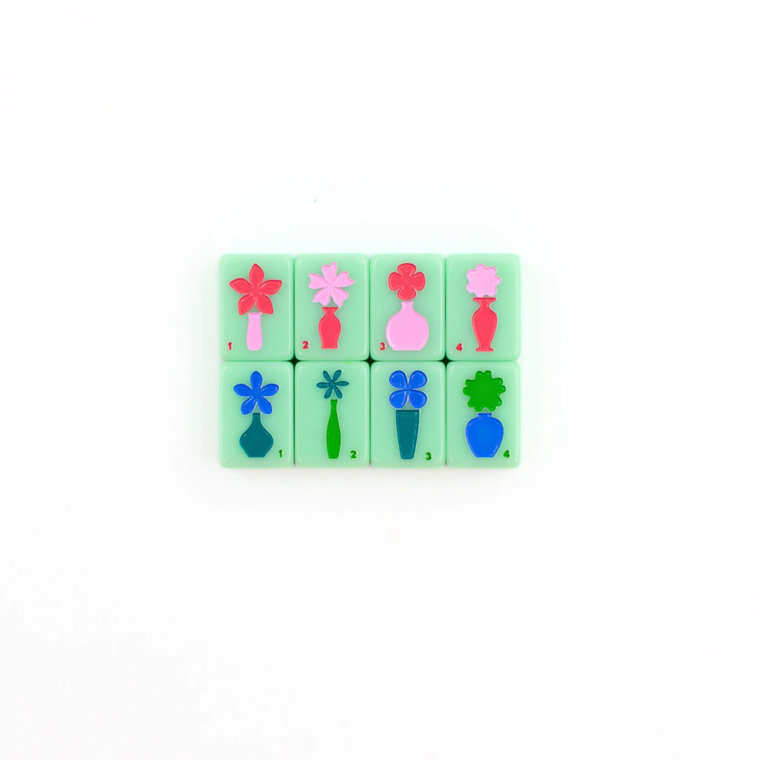Green Go Anywhere mini travel mahjong set: eight colorful flower tiles