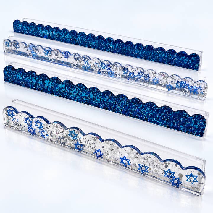 Set of four blue and silver glitter mahjong rack pushers on clear acrylic racks