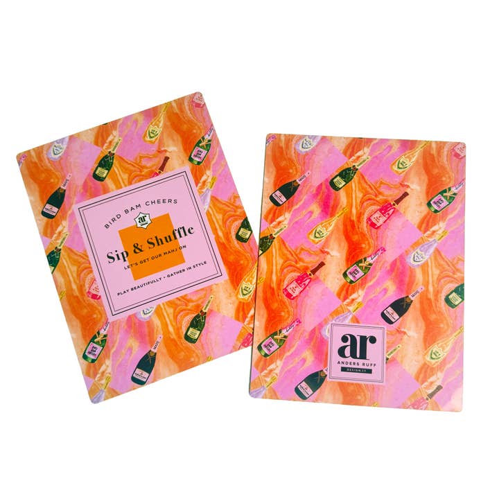 Sip & Shuffle mahjong tile shufflers — pink and orange marbled shufflers with champagne bottles and ‘Sip & Shuffle’ label
