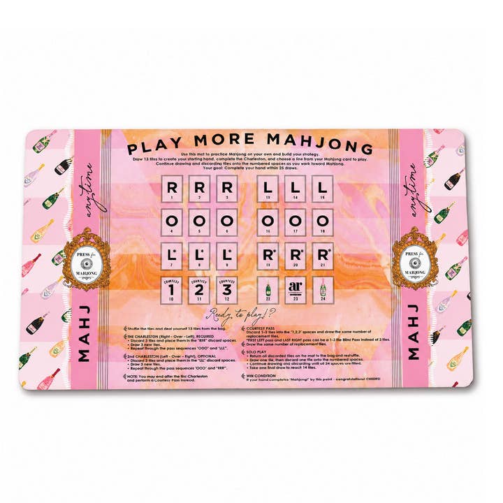 Bams & Bubbly solo play mahjong mat — pink and orange practice layout with printed Charleston passing sequences