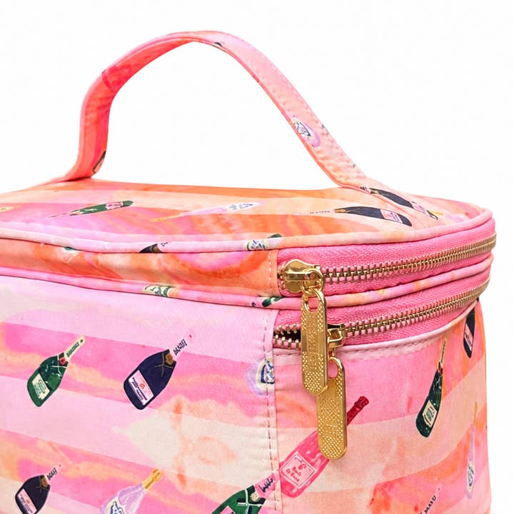 Close-up of the Bams and Bubbly tile storage case — gold zipper pulls, top carry handle, and champagne bottle print