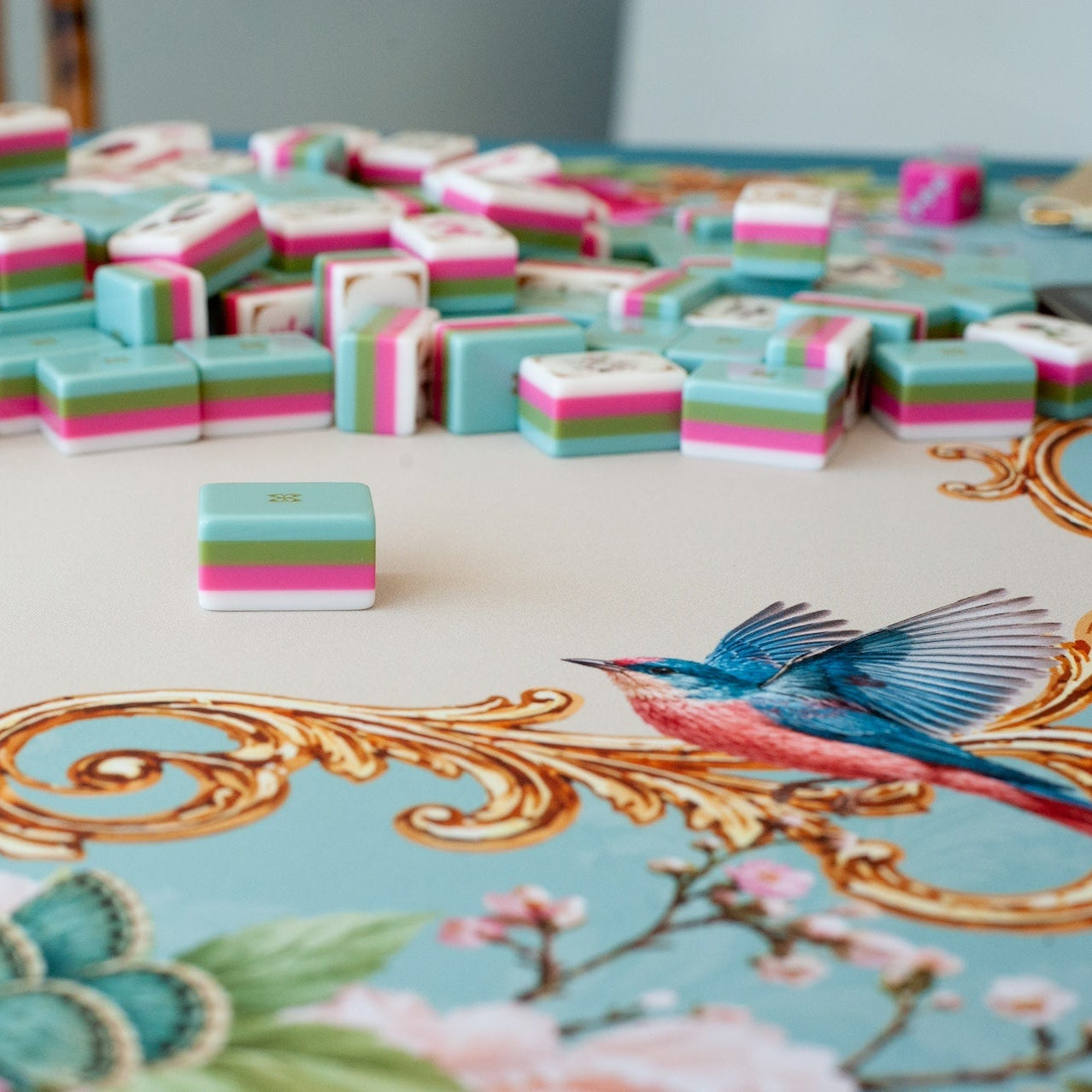 Mahj in Bloom mahjong tiles during the wash — vintage aqua backs with gold butterfly