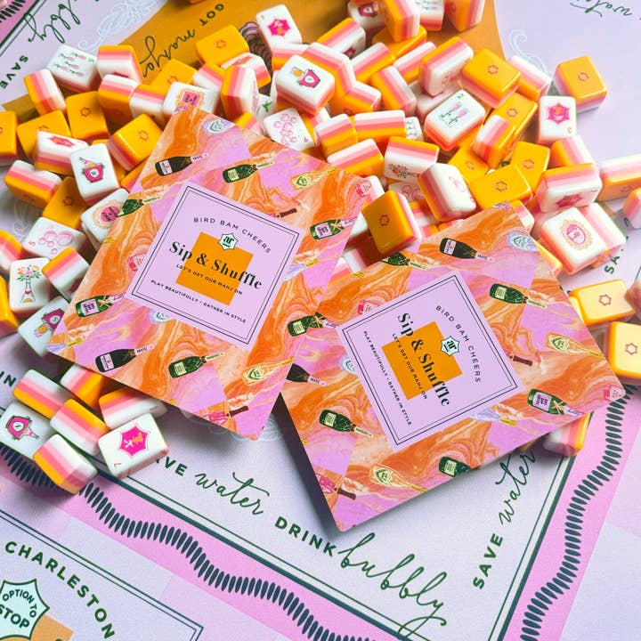 Sip & Shuffle tile shufflers styled with Bams & Bubbly mahjong tiles on the Bams & Bubbly mat