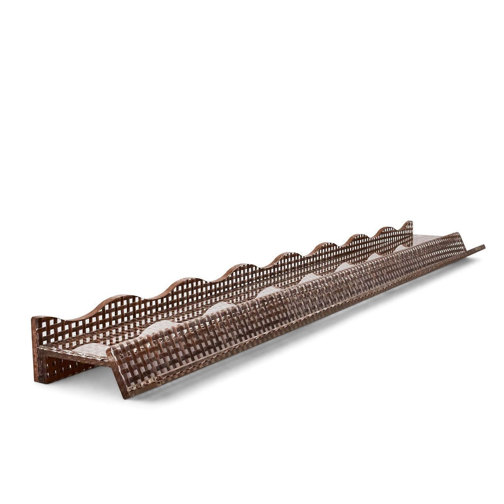 Tala Shoreline mahjong rack with wavy pusher in chocolate woven rattan — angled view showing wave silhouette